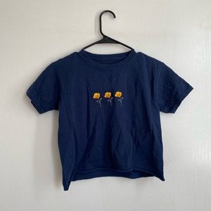 Blue raw cut tee with poppies. John Galt